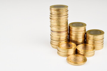 Closeup of coin stack isolated on white background