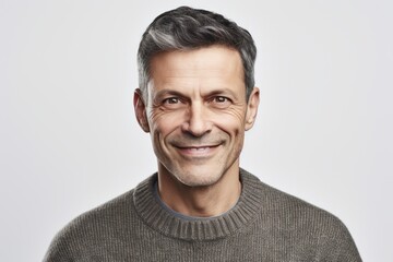 Fototapeta premium Group portrait photography of a pleased man in his 40s wearing a cozy sweater against a white background. Generative AI