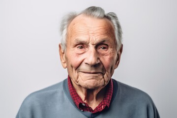 Medium shot portrait photography of a pleased man in his 80s wearing a casual t-shirt against a white background. Generative AI