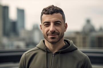 Fototapeta premium Portrait of a handsome young man with a beard in the city