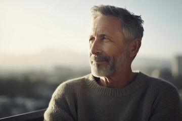 Fototapeta premium Portrait of a handsome senior man with grey hair and beard looking away
