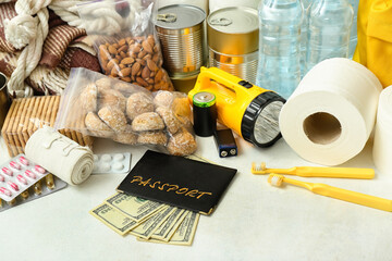 Necessities for emergency bag on white table