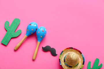 Mexican maracas with sombrero hat, paper mustache and cactus on pink background