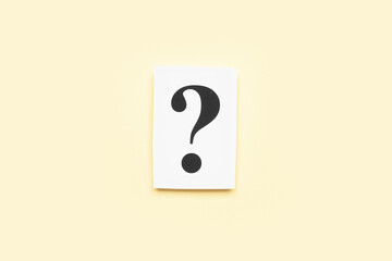 Paper with question mark on yellow background