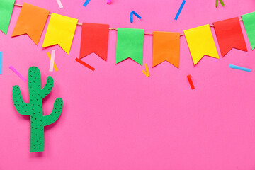 Mexican flags with paper cacti and confetti on pink background
