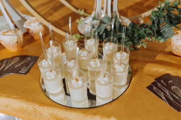 A delicious wedding. Candy bar for a banquet. Celebration concept. Fashionable desserts. Table with sweets, candies. Fruits