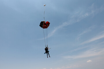 Skydiving. Tandem jump. An instructor and passenger are in the sky.