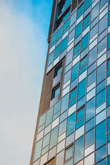 Tower block office building windows reflective glass blue sky tall architecture buildings, office block finance buildings, flats and apartments corporate structure skyscraper