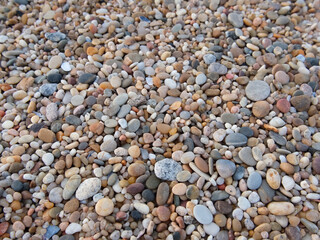 Natural pebbles on beach. Background texture.