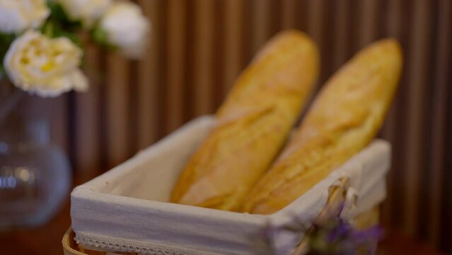 Taking some bread and rolls at the breakfast table - stock photography