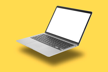 One modern laptop flying on yellow background