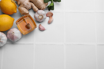 Cold remedies on white tiled table, flat lay and space for text. Cough treatment