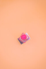 Pink lipstick on the minimal, isolated background.