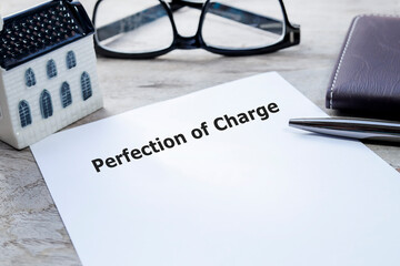 Perfection of Charge document on the wooden office table to sign