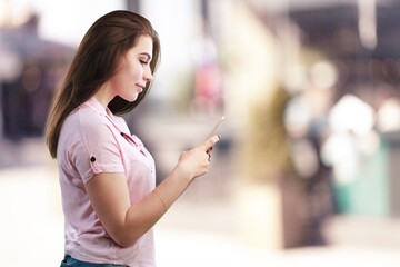 Beautiful young woman using smartphone