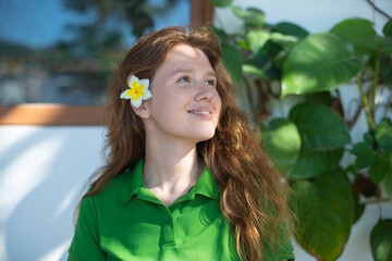 portrait of a young positive girl near her house, eco concept, country life, spring, summer, garden, green city