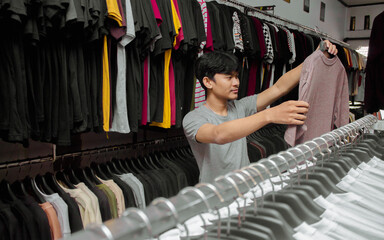 Young people shopping for clothes in a clothing store