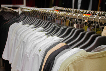 clothes hanging in a clothing store