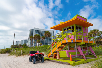 Fototapeta na wymiar image of lifeguard at miami beach with quad bike. lifeguard at miami beach.