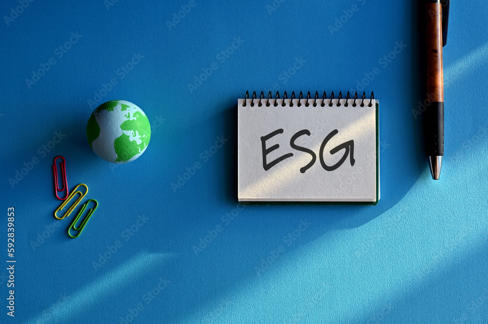 Poster there is a notebook with the word esg. it is eye-catching image.