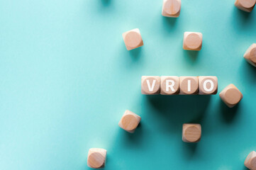 There is wood cubes with the word VRIO. It is an abbreviation for Value, Rarity, Inimitability,...
