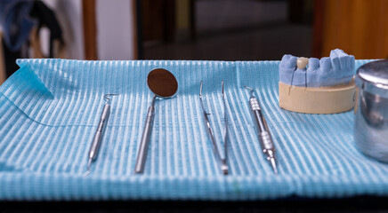 A close-up shot of dental tools tray arranged in a neat order, ready for use in a dental office or...