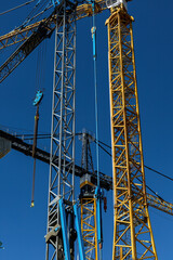 Copenhagen, Denmark  Cranes standing against the blue sky in the Carlsberg Byen district.