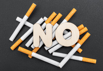 Word NO on the heap of cigarettes. Quit of smoking concept.