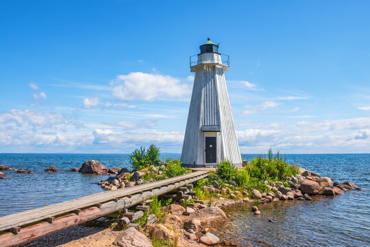 Wooden Lighthouse By Lake Vattern With A Jetty In Sweden