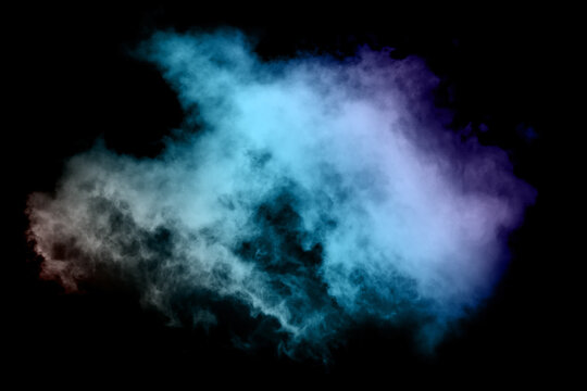 Colorful smoke with many colors on a black background.