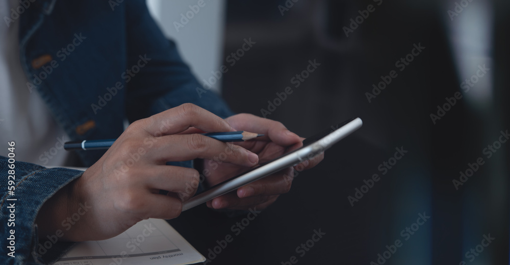 Wall mural business woman hand using mobile phone, typing on smartphone screen during planning work with calend