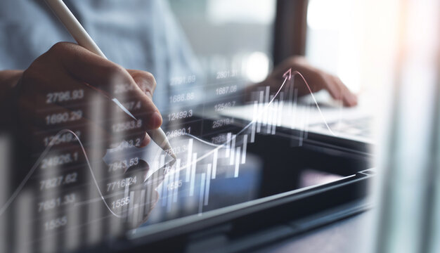Businessman using digital tablet analyzing sales data and economic growth graph chart, Business strategy and planning, marketing report, business development concept