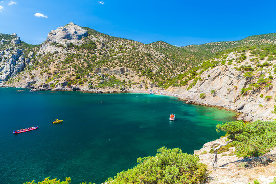 Pleasure boats at the Cape Kapchik, Crimean landscape with Black Sea