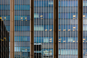 Reflections and light of glass and metal skyscraper