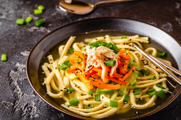 Traditional Korean chicken soup with homemade noodles