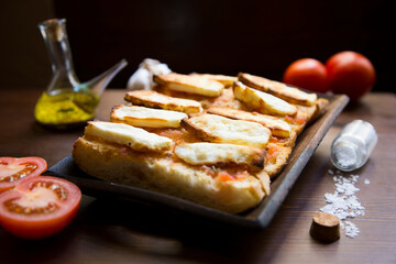 Baked halloumi cheese served with toasts.
