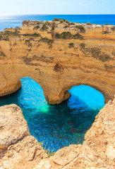 Beautiful heart rock formation,  coast of the Algarve- Tourism,  travel,  vacation in Europe (natural cave or arch on praia da marinha)