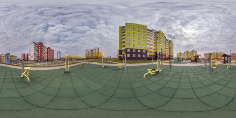 360 hdri panorama view outdoor exercise equipment gym among modern residential complex with skyscrapers and high-rise buildings in equirectangular spherical projection ready VR virtual reality content