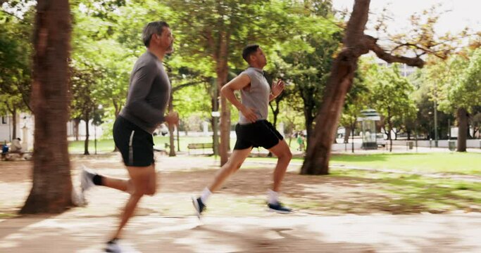 Men, running or outdoor park for athletes in fitness, workout or run training. Nature trail, wellness or exercising male friends or mature personal trainer runner in sports cardio, health or exercise