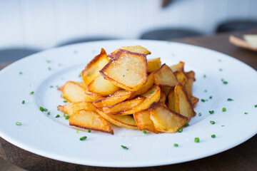 French Fries are potatoes that are made by cutting them into batons and frying them in hot oil until golden brown and crisp.