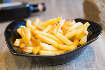 French Fries are potatoes that are made by cutting them into batons and frying them in hot oil until golden brown and crisp.