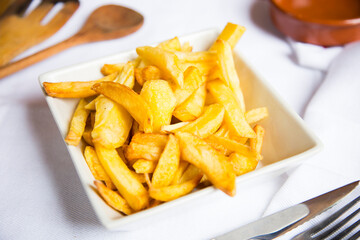 French Fries are potatoes that are made by cutting them into batons and frying them in hot oil until golden brown and crisp.