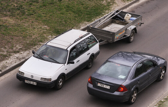 Belarus, Minsk-13.04.2023: Volkswagen Passat B3 with a trailer moves along the road. 