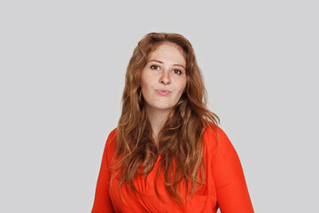 Cheerful healthy model woman with freckles looking at camera