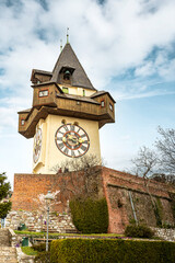 Fototapeta na wymiar View at the clock tower in Graz city in early spring