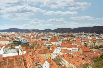 Fototapeta na wymiar Cityscape rooftop view over Graz city, austria, in early spring in april