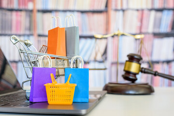 Consumer rights and consumer protection, business law concept : Shopping basket, shopping bags and ...