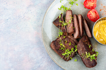 Fried tasty ostrich steaks.