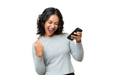 Young Argentinian woman over isolated background with phone in victory position