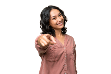Young Argentinian woman over isolated background pointing front with happy expression